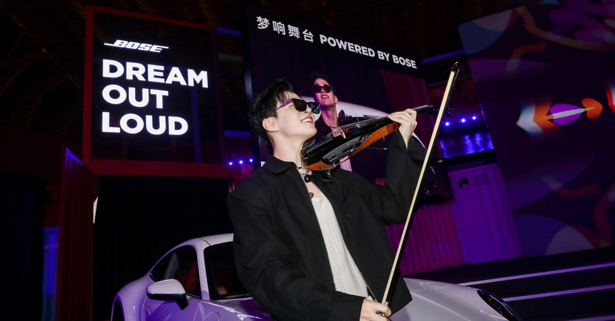 man playing violin on stage